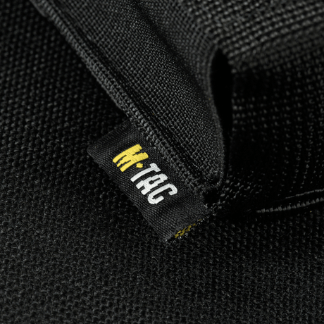 Close-up of M-Tac Gasdåseholder Vertikal focusing on black fabric and M-Tac logo on the label.