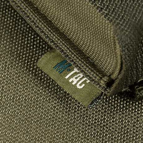 Close-up of M-Tac Vertical gas canister holder made of robust material with clear M-Tac logo, for quick access to gas canisters.