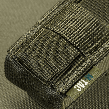 Close-up of M-Tac Vertical gas canister holder in robust MIL-SPEC material, suitable for MOLLE system, with secure Woojin buckle, black.