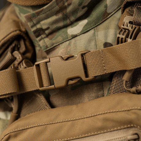 Close-up of M-Tac Sturm Elite Gen.II with sturdy buckle and camouflage background, ideal for tactical activities.