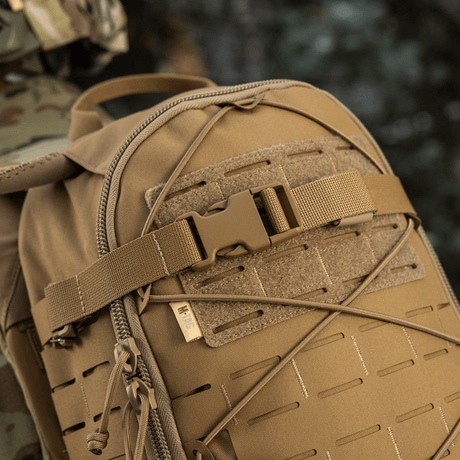 M-Tac Sturm Elite Gen.II backpack with bungee cord and MOLLE system for extra gear, suitable for field survival.
