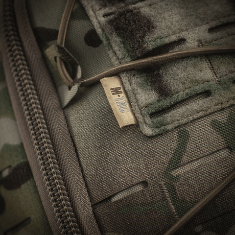 Detailed view of M-Tac Sturm Elite Gen.II produced in robust Cordura material with camouflage pattern and zipper closure.