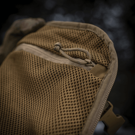 Detail of M-Tac Sturm Elite Gen.II backpack with mesh pocket for EDC gear, made of durable Cordura for outdoor use.