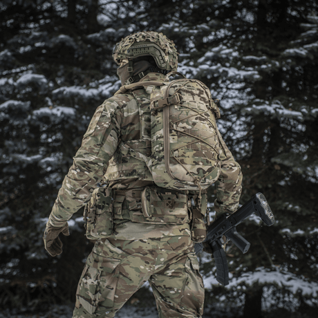 M-Tac Sturm Elite Gen.II on military personnel in camouflage in a forest environment in winter.
