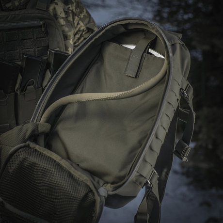 M-Tac Sturm Elite Gen.II shows suitcase-style main compartment and hydration system, ideal for field trips with MOLLE system for extra gear.
