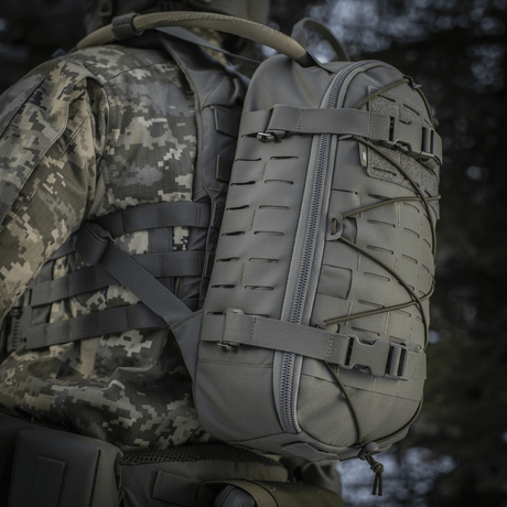 M-Tac Sturm Elite Gen.II worn by a person in military gear, gray color, equipped with MOLLE system and elastic cording.