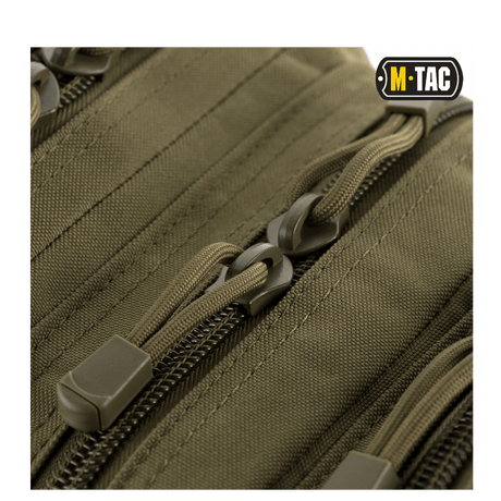 Close-up of zippers on M-Tac Assault Pack with MOLLE system and padded shoulder straps