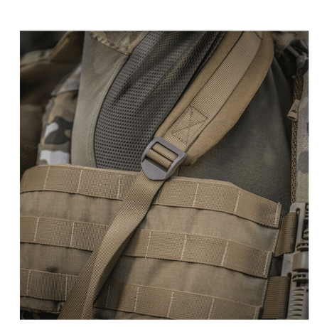 Brown M-Tac Large Assault Pack Backpack with MOLLE system and adjustable shoulder straps, close-up view of the carry strap