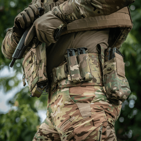 M-Tac Double Magazine Pouch APS Laser Cut mounted on a soldier's belt in camouflage.