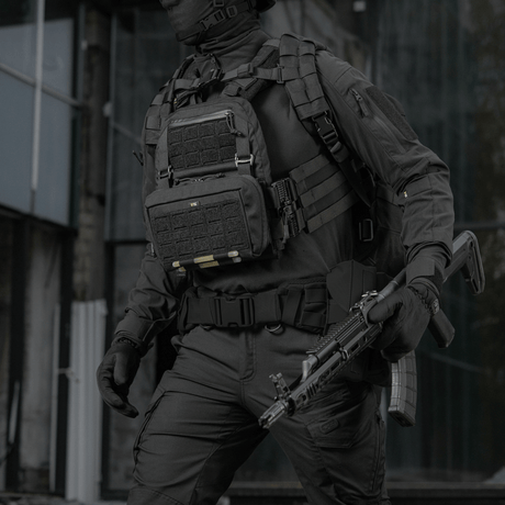 Tactical operator wearing M-Tac Admin Pouch Large Elite, for storing items like documents and a flashlight, made from Cordura 500D.