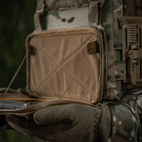 Image of M-Tac Admin Pouch Large Elite in action, showing storage of tactical gear in durable Cordura material, suitable for outdoor use.