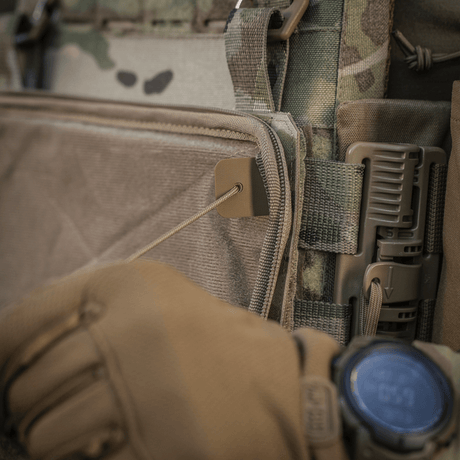 Close-up of M-Tac Admin Pouch Large Elite attached to tactical gear with gloved hand adjusting strap.