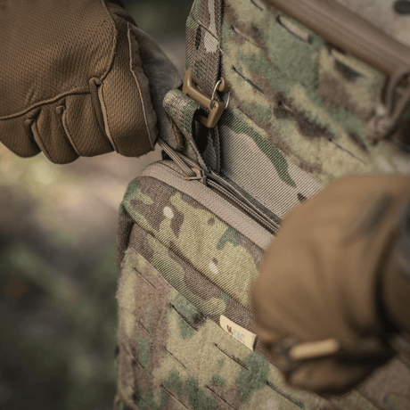 Close-up of M-Tac Admin Pouch Large Elite in use, showing robust Cordura material and tactical zipper design in a natural environment.