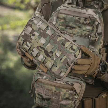 M-Tac Admin Pouch Large Elite in use, held by person in tactical gear, camouflage pattern, robust Cordura 500D material.