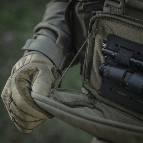 Tactical use of M-Tac Admin Pouch Large Elite for storing flashlight and gear.