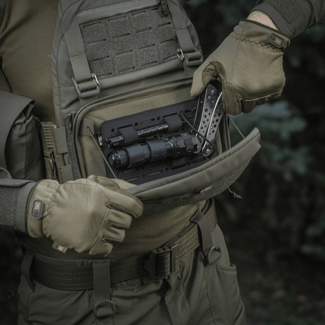 Person opens M-Tac Admin Pouch Large Elite with tactical gear, made from durable Cordura 500D, suitable for outdoor use.