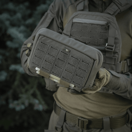 Tactical M-Tac Admin Pouch Large Elite held by person wearing uniform with velcro panels, made from durable Cordura 500D.