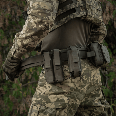 M-Tac Range Belt Cobra Buckle Gen.IV on tactical gear with magazine pouches and first aid equipment in military camouflage pattern