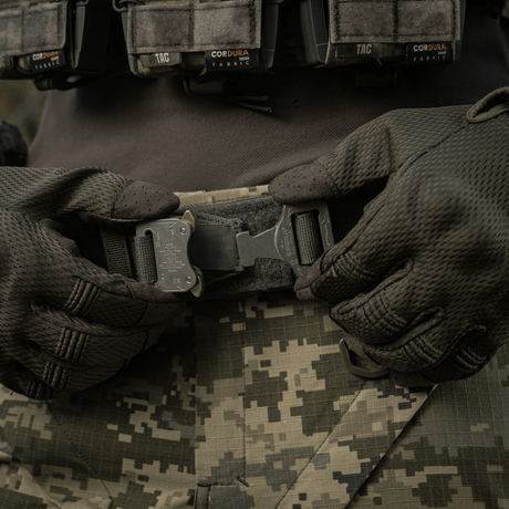 M-Tac Range Belt Cobra Buckle Gen.IV on a tactical uniform, ideal for military and active use with attachment points for gear