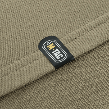 Close-up of M-Tac Pullover 4 Seasons with stretch fabric label, ideal for everyday and tactical activities year-round