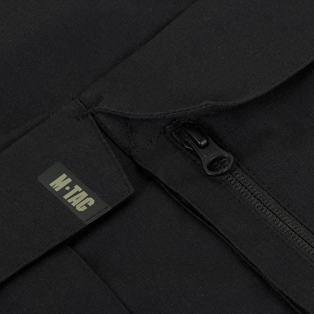 Nærbillede af lynlås og M-Tac logo på M-Tac Bukser STURM NyCo Extreme Gen.II