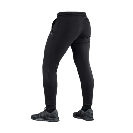M-Tac Cotton Classic pants with comfortable elastic waist, suitable for running and fitness, seen from the back, 100% cotton with side pockets.