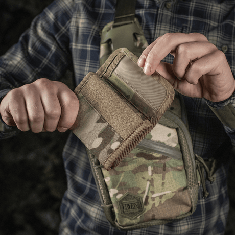 Person holding M-Tac Pung Elite Gen.II made from Cordura 500D with M-Tac logo and YKK zippers. Ideal for cards, bills and coins.