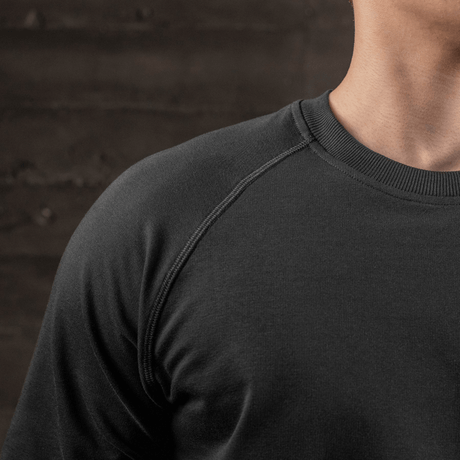 Close-up of M-Tac Raglan Athlete sweatshirt, black, with raglan sleeves and crew neck.