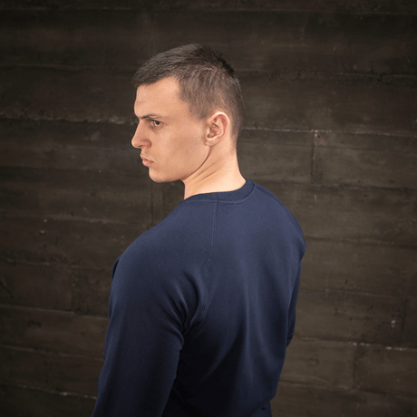 Man wearing M-Tac Raglan Athlete sweatshirt with crew neck and raglan sleeves in navy, side view, ideal for sport and everyday.