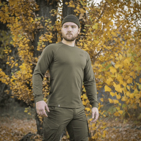 Man wearing M-Tac Raglan Athlete sweatshirt in olive for autumn.