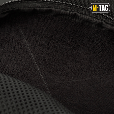 Close-up of the interior of M-Tac Buckler Bag Elite in black Cordura material with soft padding. Focus on tactical storage.