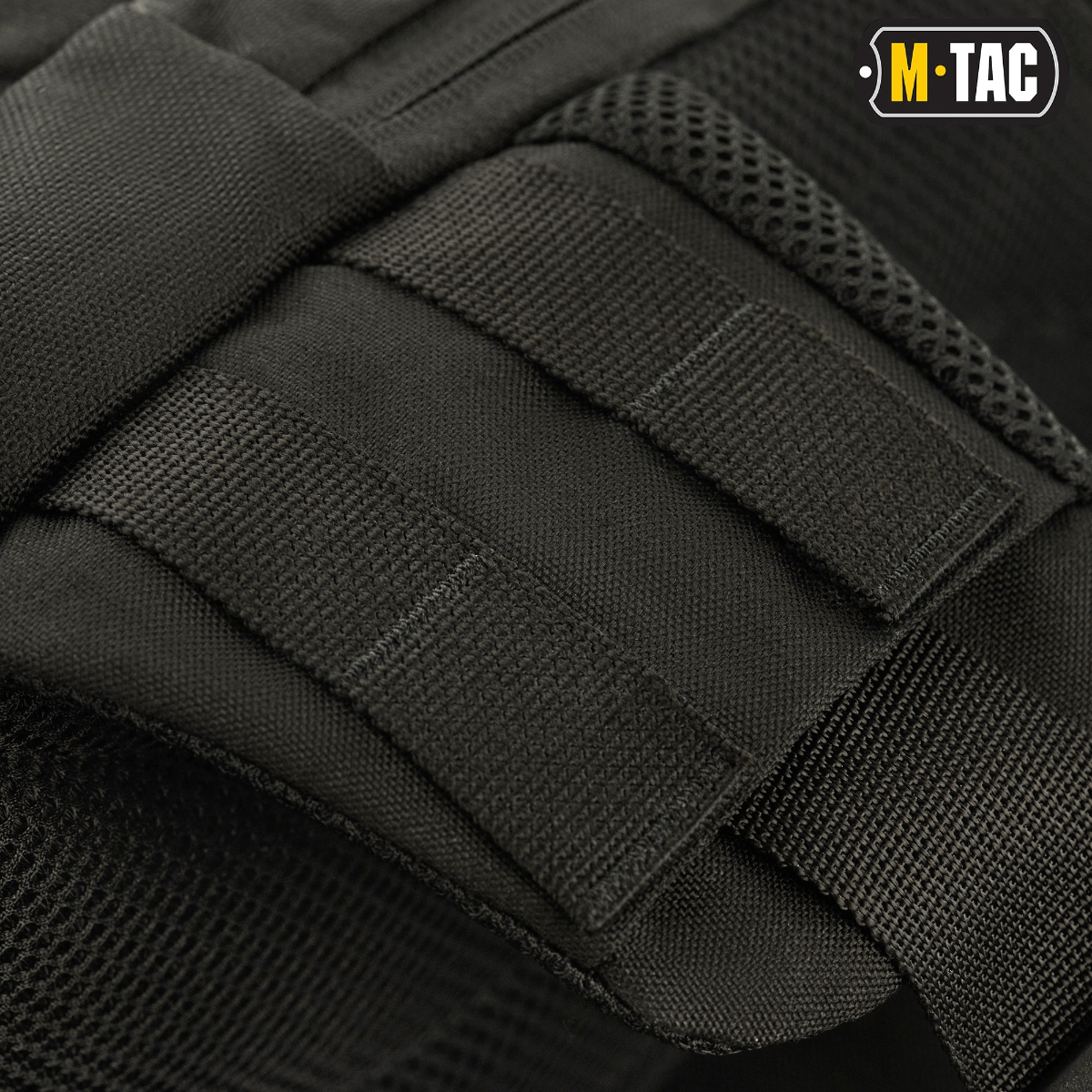 Detaljer af M-Tac Buckler Taske Elite med MOLLE-system til ekstraudstyr og stærke Cordura 500D materialer.