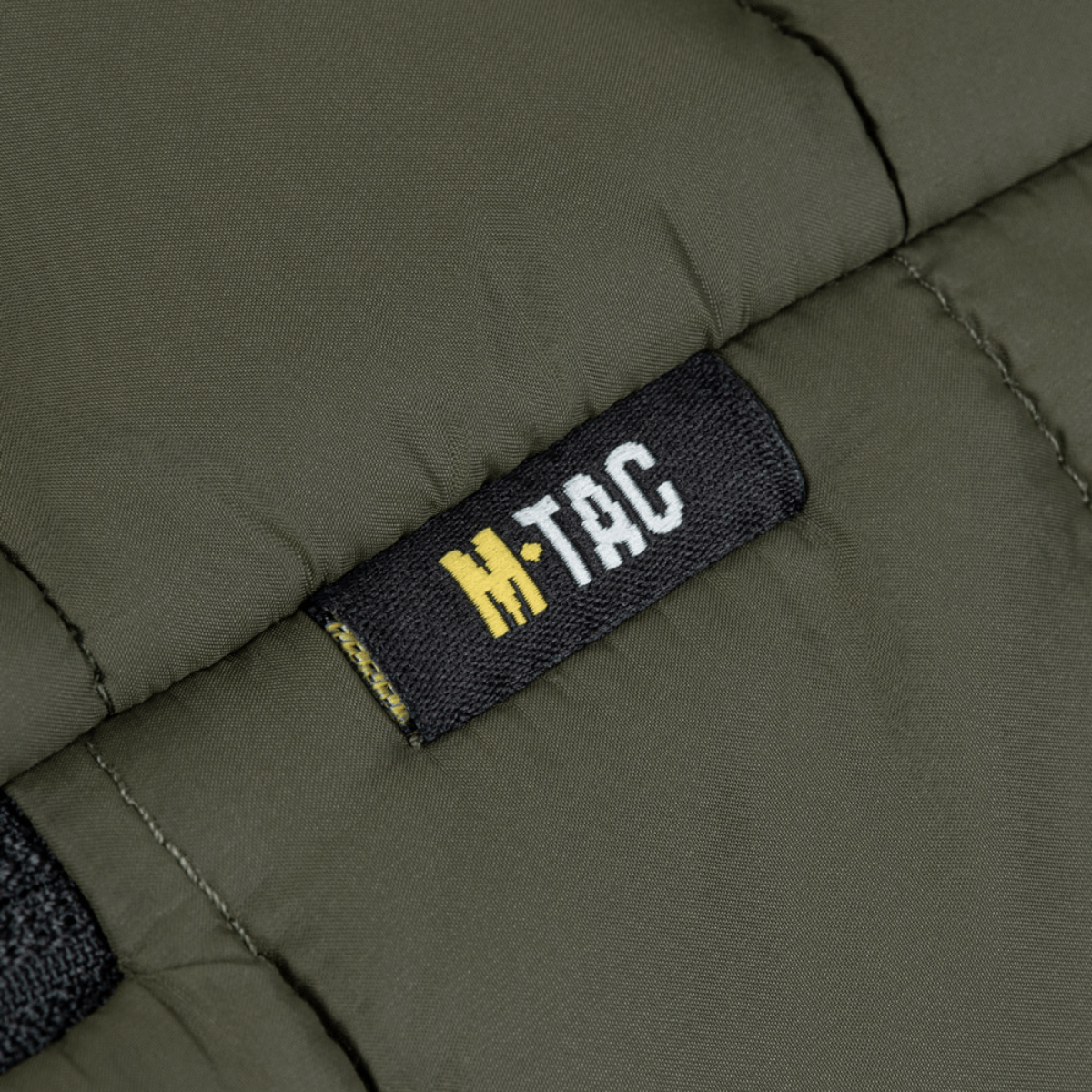 M-Tac Stalker Gen.III Jakke i oliven med M-Tac logo, moderne design og varmeisolering, perfekt til overgangssæsonen.