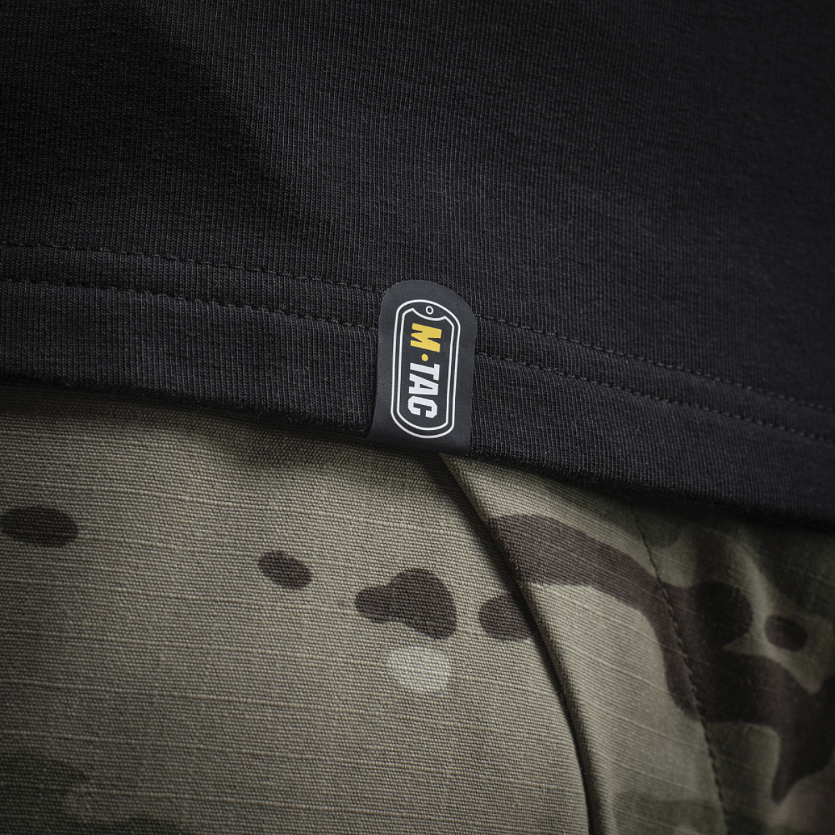 M-Tac Raglan Odin Mystery label close-up on a premium cotton blend shirt featuring Nordic theme design, perfect for casual tactical wear.