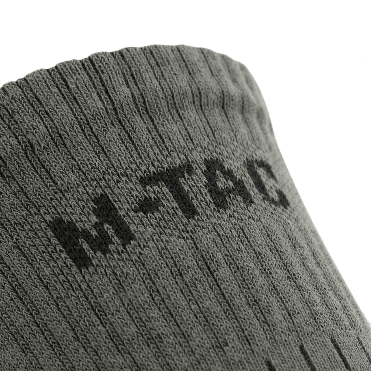 M-Tac Sokker Mk.1 med ribstrik design, komfort og støtte under krævende aktiviteter. Ideel til langdistanceture.