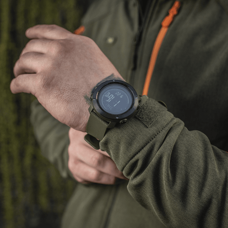 M‑Tac Multifunctional Tactical Watch with electronic compass and 3D pedometer shown on a hand, ideal for outdoor activities and military use