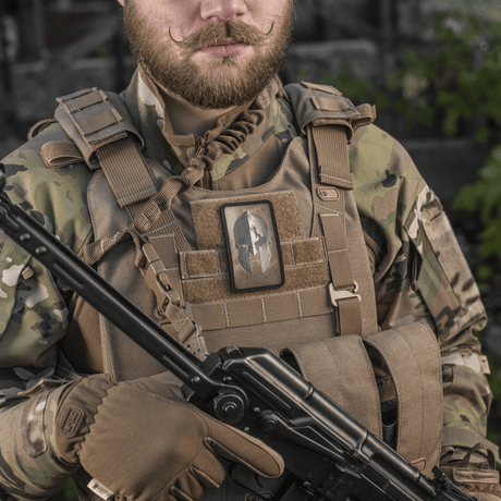 M-Tac Spartan Helmet Patch in use on a tactical vest, symbolizes courage and strength, vintage Spartan design, Velcro fastening for gear.
