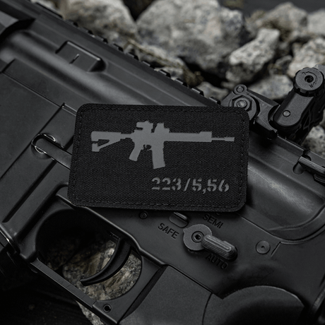 M-Tac AR-15 223/5,56 Laser Cut Patch on black AR-15 with gravel background, Velcro fastening, Cordura 500D, tactical design.