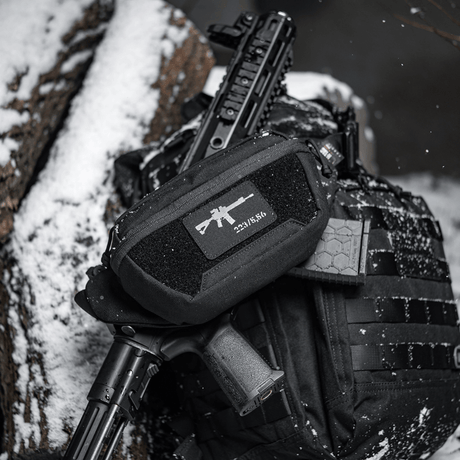 M-Tac AR-15 223/5,56 Laser Cut Patch on tactical bag in snow, sturdy patch for military, airsoft and outdoor with Velcro.