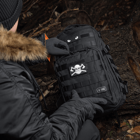 M-Tac Bearded Skull 3D PVC Patch on black backpack, outdoor setting, Velcro fastening, PVC material, tactical design.