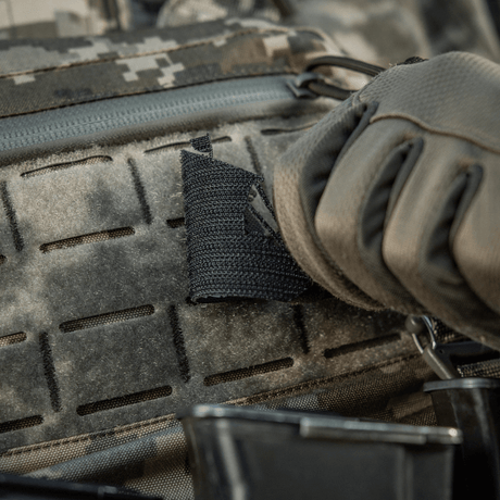 M-Tac Patch Viking Evac mounted on tactical equipment in a camouflage pattern.