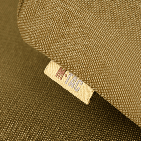 M-Tac Seat Mat with ARMOR belt fitting in Cordura 1000D, close-up of the label, for cold and damp conditions.