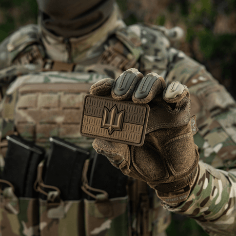 Soldier wearing camouflage clothing displays M-Tac Ukraine Flag patch with ZSU Trident PVC