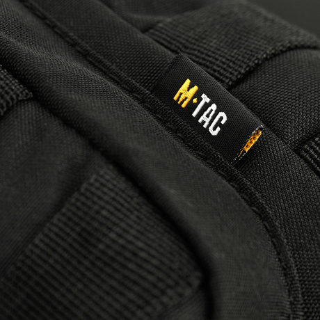 M-Tac Assistant Bag with adjustable single strap and MOLLE panels in black 600D material. Practical for daily use.