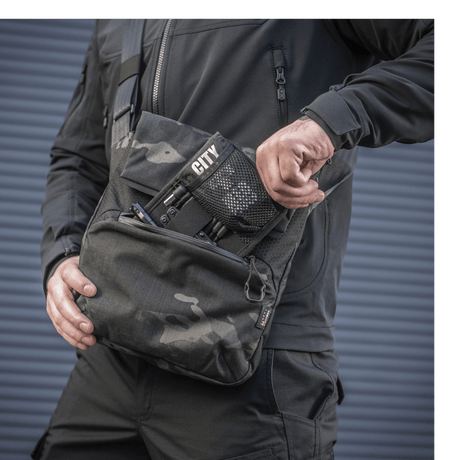 M-Tac Konvert Bag Elite in use, made of durable Cordura material, with adjustable shoulder strap and quick-access magnetic closure.