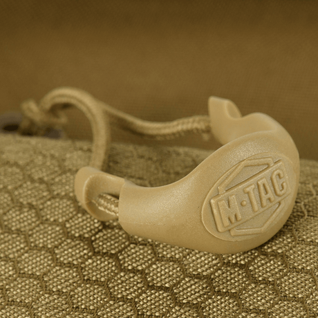 Close-up of M-Tac Konvert Taske Elite with magnetic flap closure mechanism and robust Cordura material.