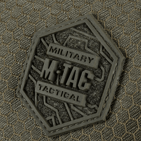 Close-up of M-Tac Konvert Taske Elite label in durable material Cordura Hex 1000D.