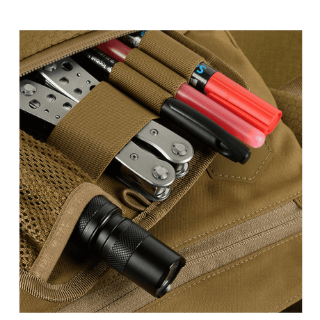 Detailed view of M-Tac Konvert Taske Elite with practical storage for tools and a flashlight, made of durable Cordura material.