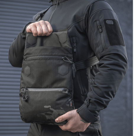 M-Tac Konvert Bag Elite in black with a magnetic flap, durable Cordura material and adjustable shoulder strap, for carrying a tablet.