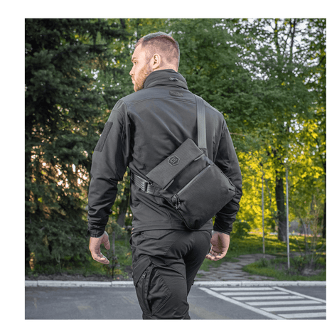 Man wearing M-Tac Konvert Taske Elite in woodland surroundings.